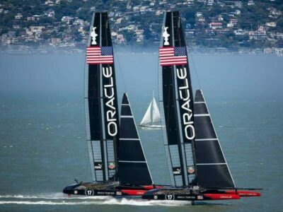 two sailing race yachts with Oracle logo